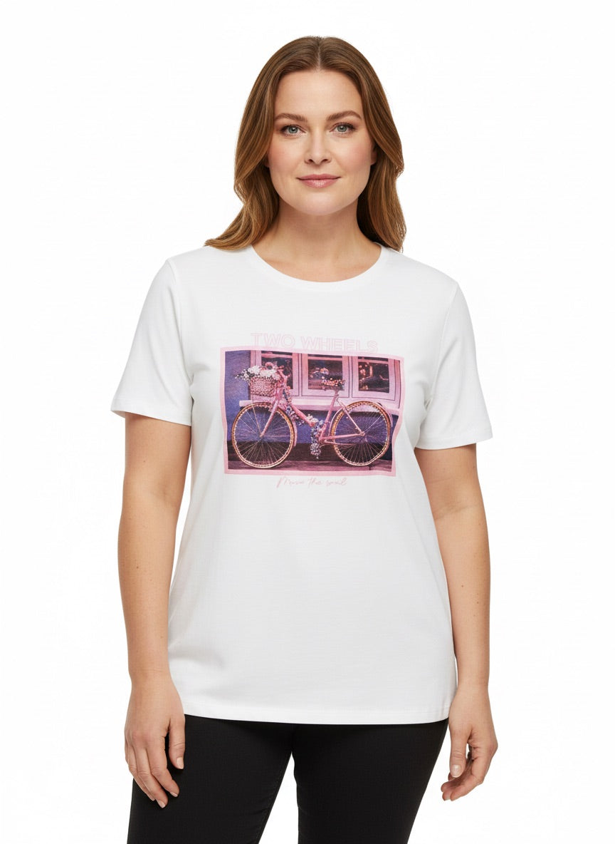 A front facing woman wearing a white t-shirt with a pink bike photo on it. On a white background
