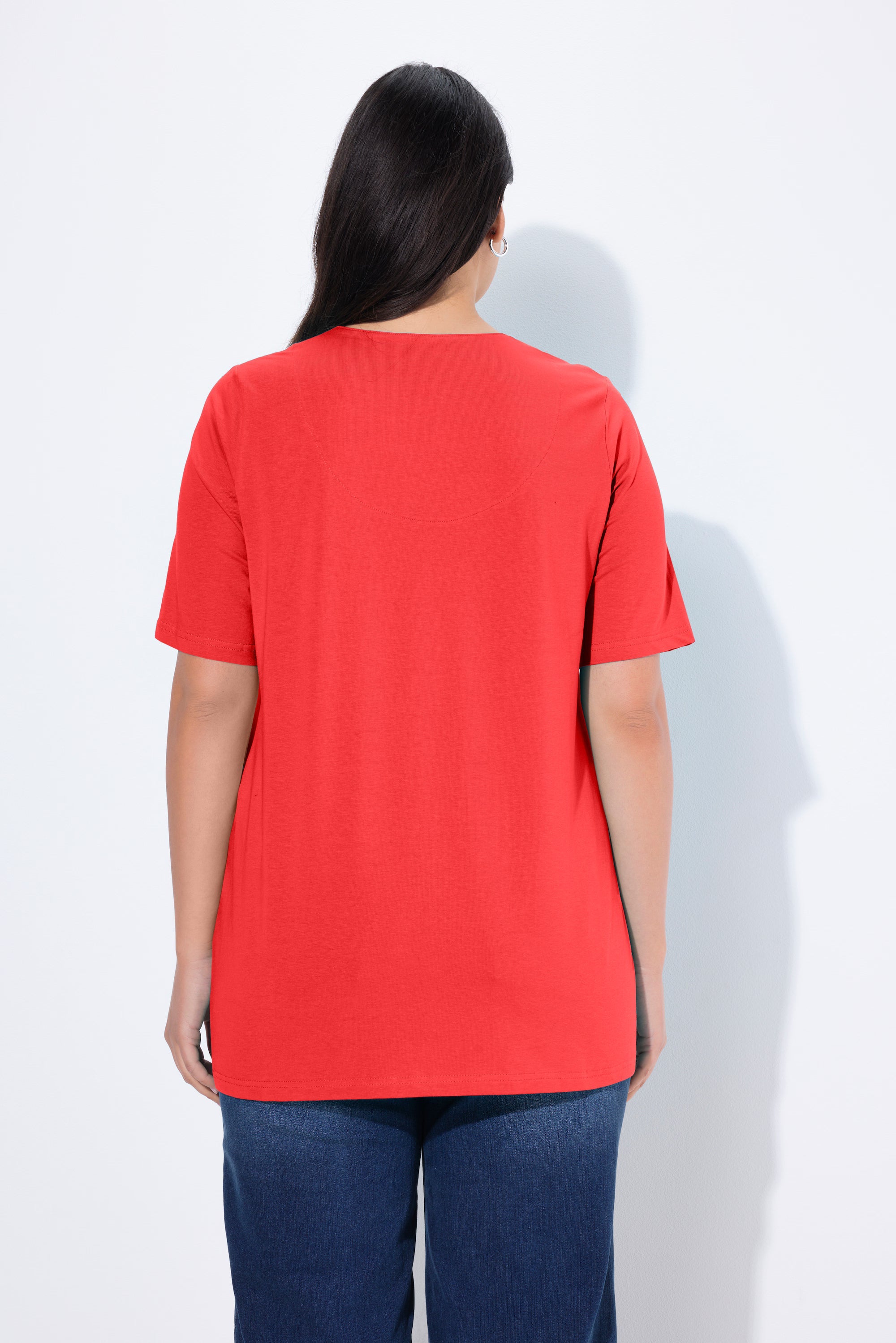 Ulla Popken Tunic Neck T-Shirt in Red, back view, a red T-shirt with short sleeves, an A-line shape and a Tunic neck line, worn with blue jeans