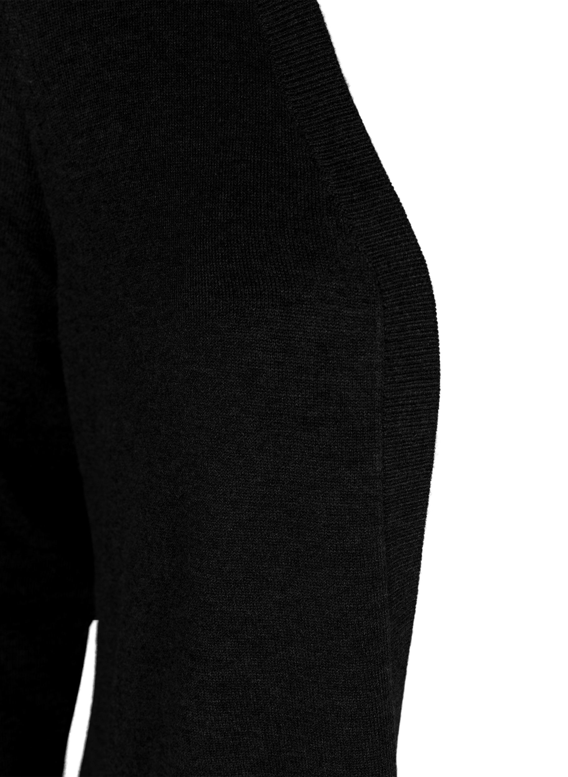 Close up of Black cardigan with a ribbed edge on a white background